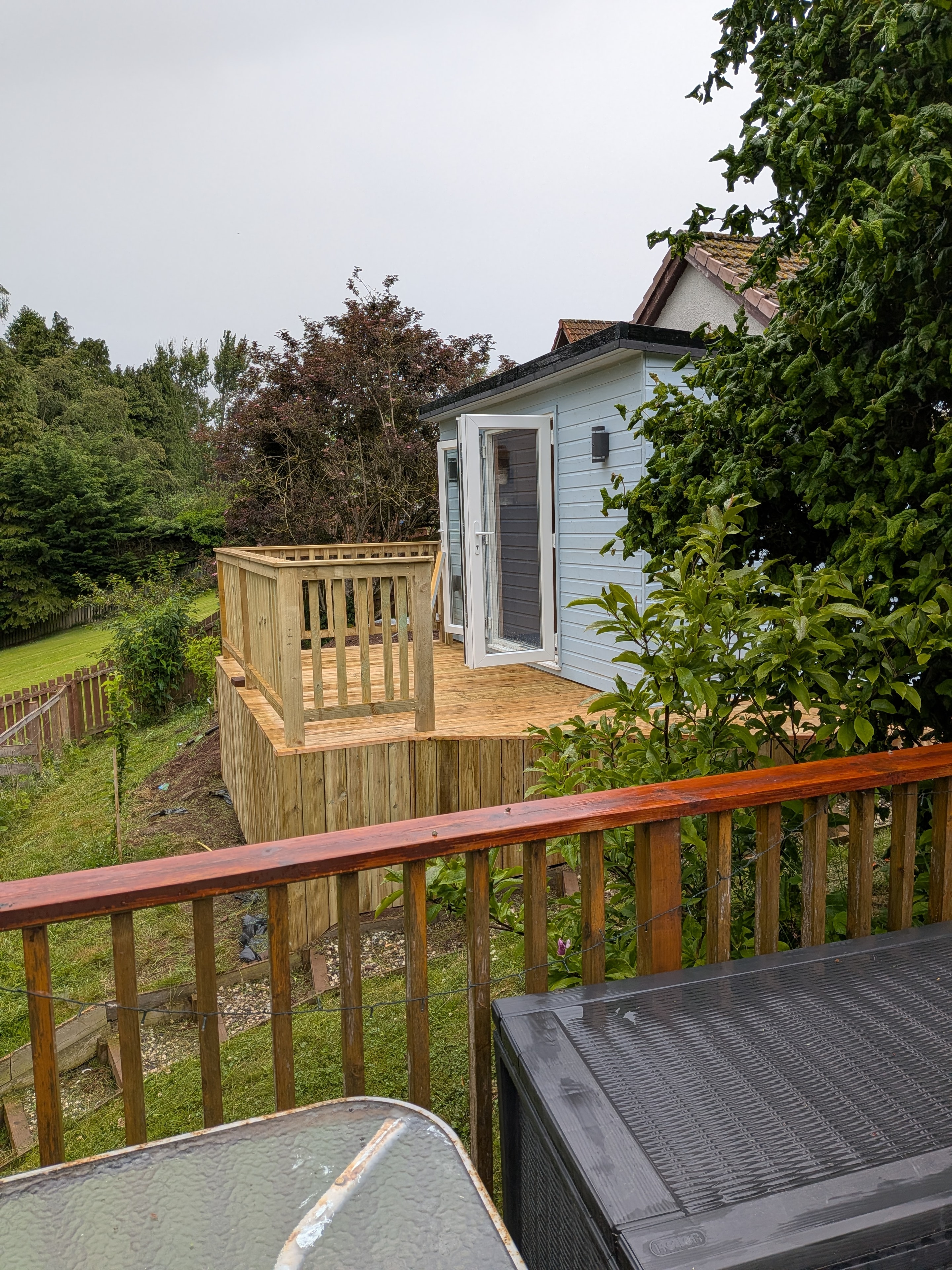 Bespoke garden cabin with wooden deck
