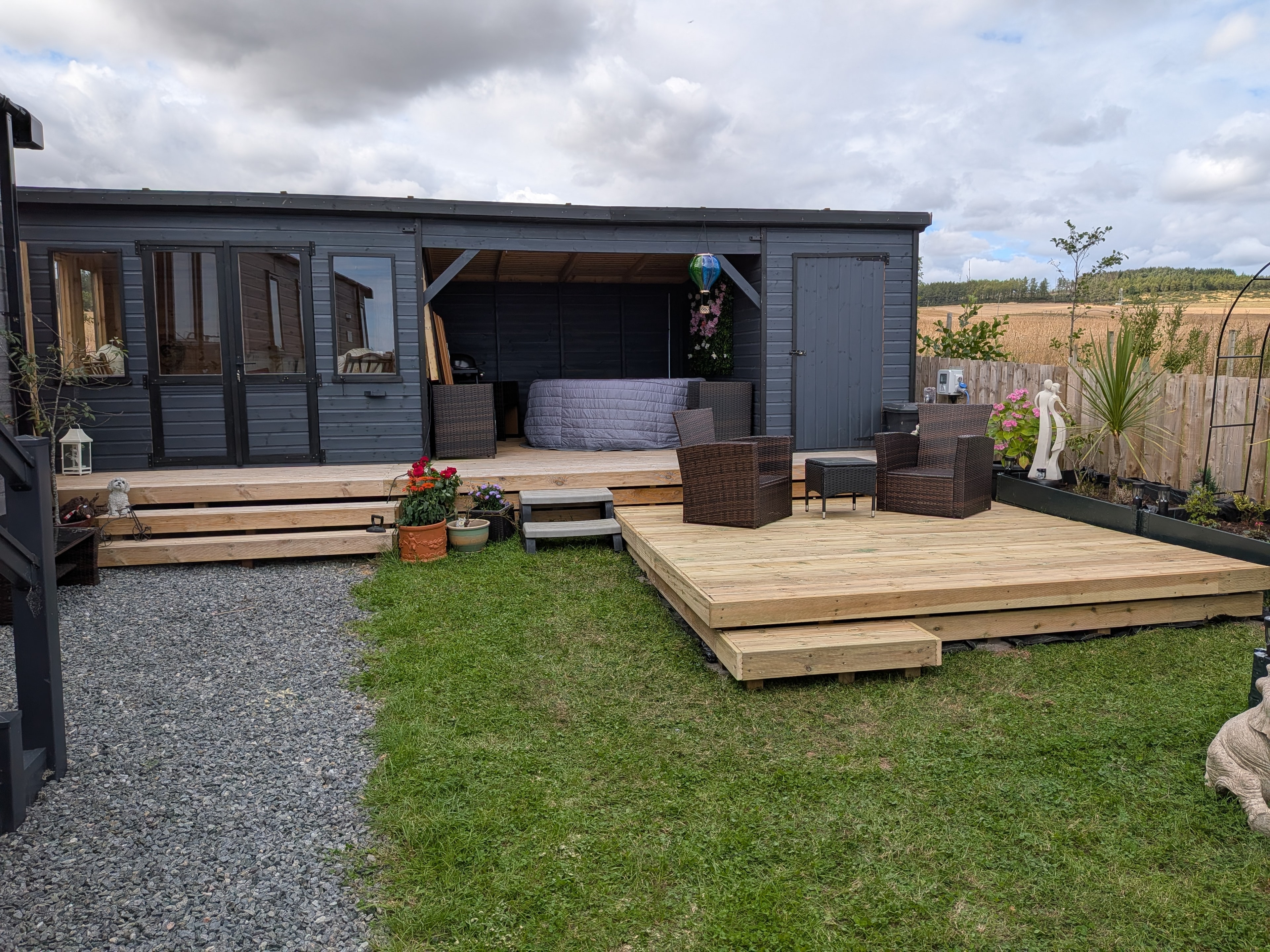 Bespoke garden studio with wooden deck patio